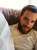 Look at him pretend to read the paper! Look at him pretend to read the paper!