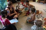 The other kids are happy to help unwrapping.