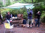 Tony makes a rain shelter. Tony makes a rain shelter.